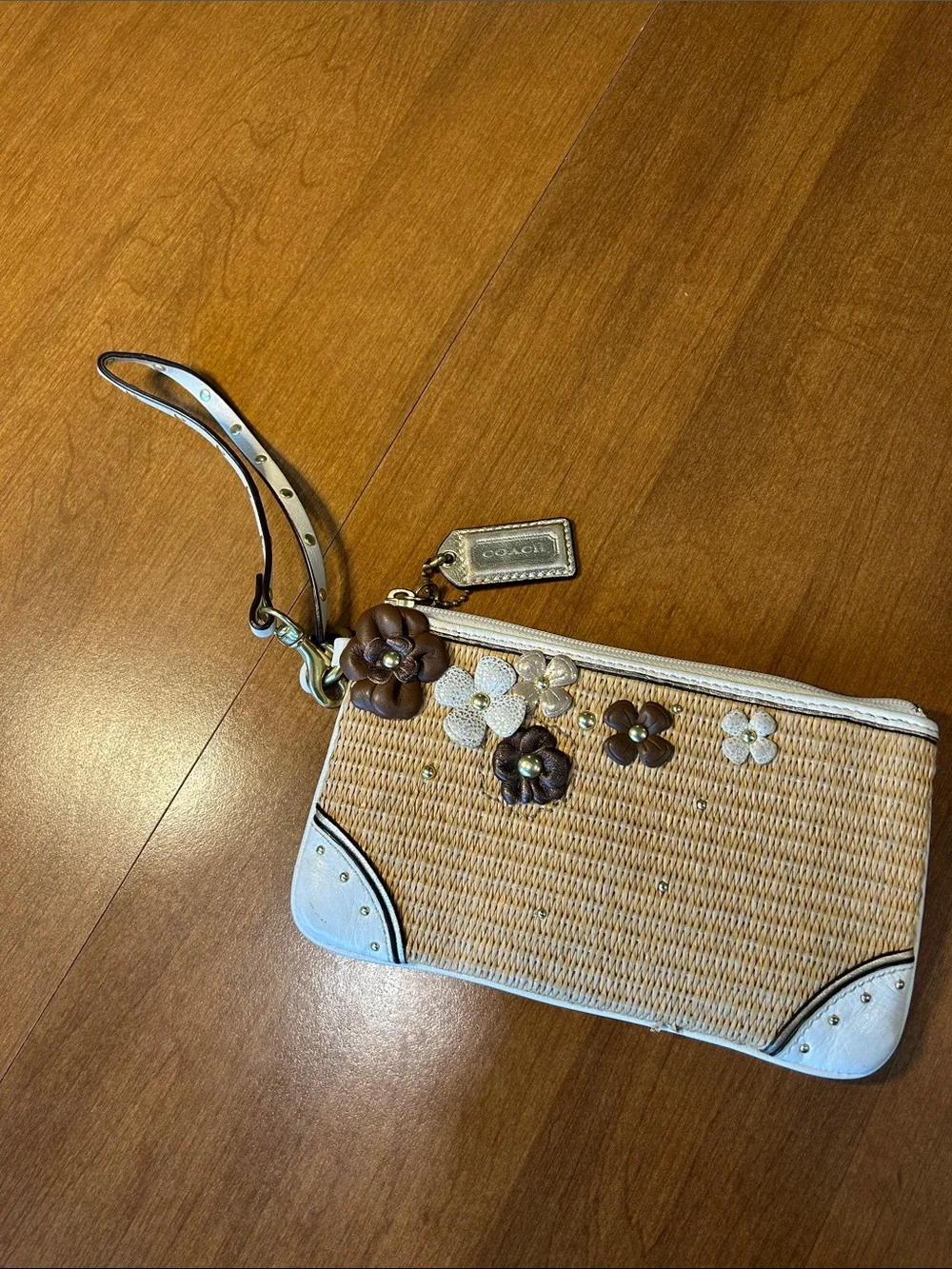 Coach Straw Wristlet with White Trim and Brown Floral Appliqués 2010